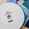 رول برچسب لیبل برادر مشکی رو سفید Genuine Brother DK-11207 CD/DVD Film Label Roll – Black on White, 58mm diameter